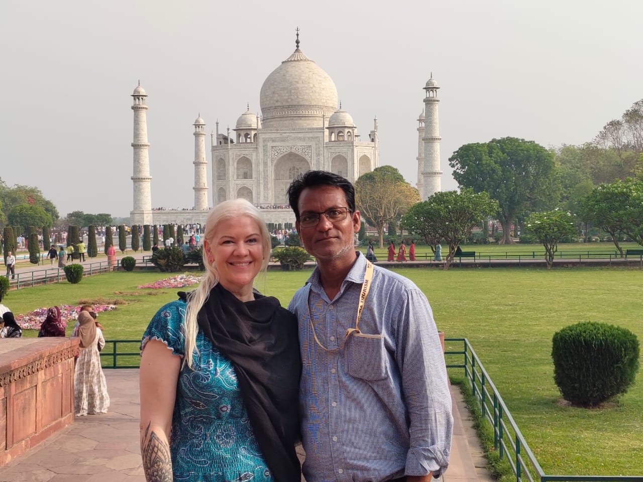 Mr. Verma with tourists smiling